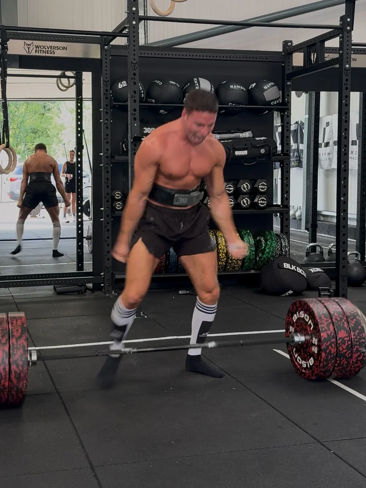 Murray Clark performing a 245kg deadlift in the gym