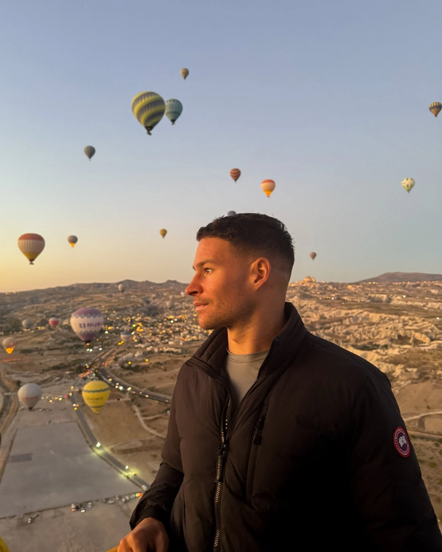 Murray Clark overlooking Cappadocia with hot-air balloons in the morning sky