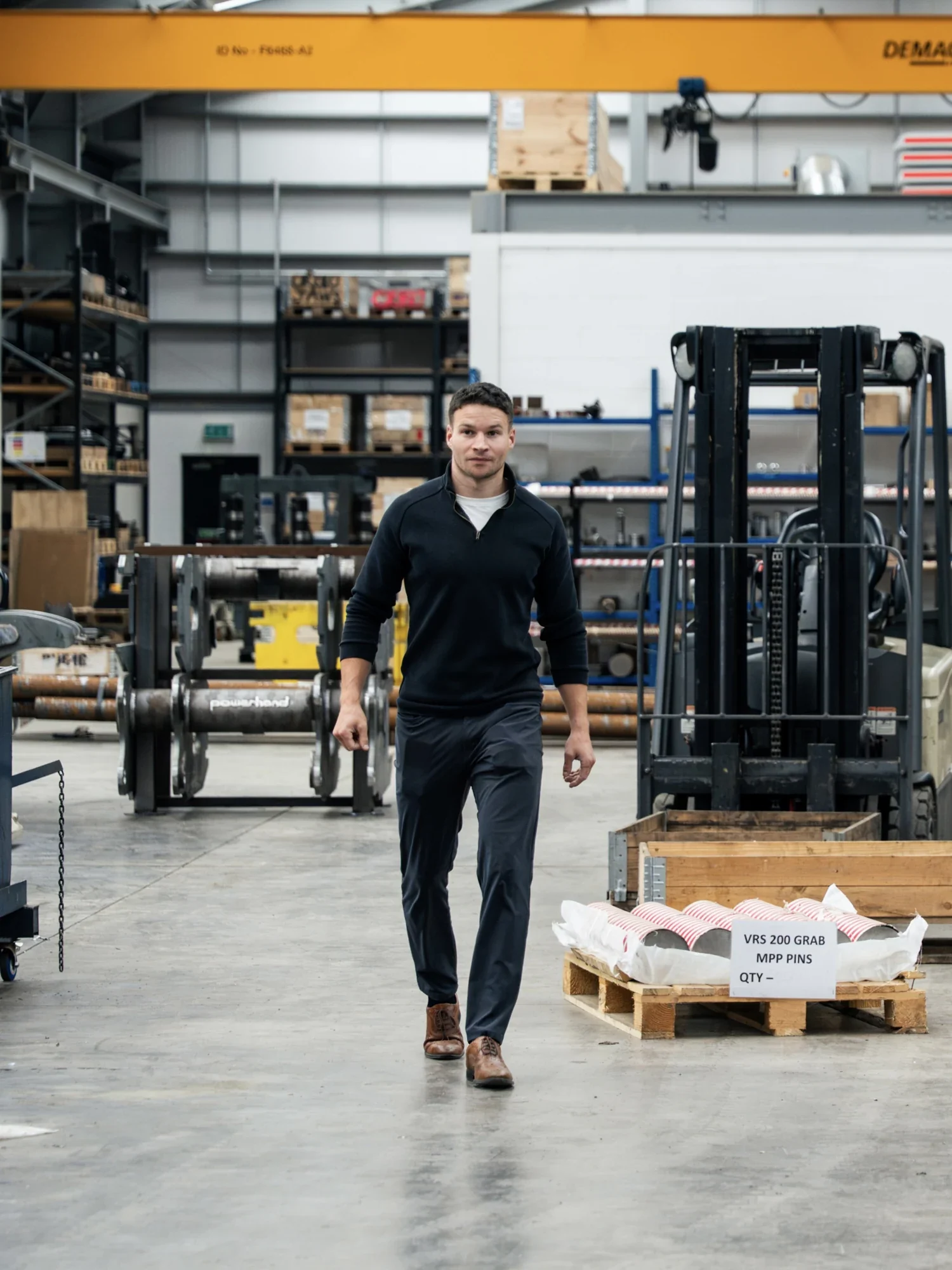 Murray Clark walking through the engineering factory